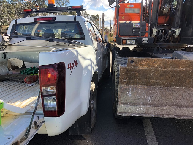 Image of reversing excavator