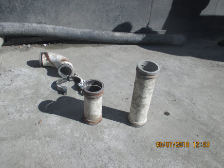 Image of the rubber end (discharge) hose, coupling, elbow and two pump line components.