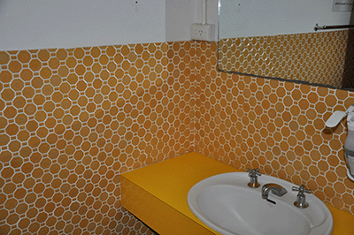 A tiled wall with Wall sheeting behind tiles