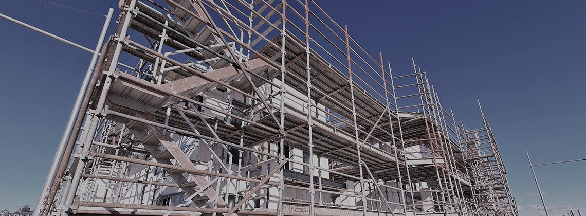 Scaffolding around a building under construction