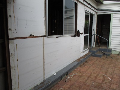 Damage to ACM sheeting in preparation for cladding