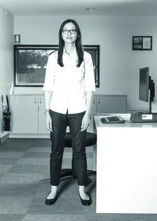 Stand next to your desk, with feet shoulder width apart.