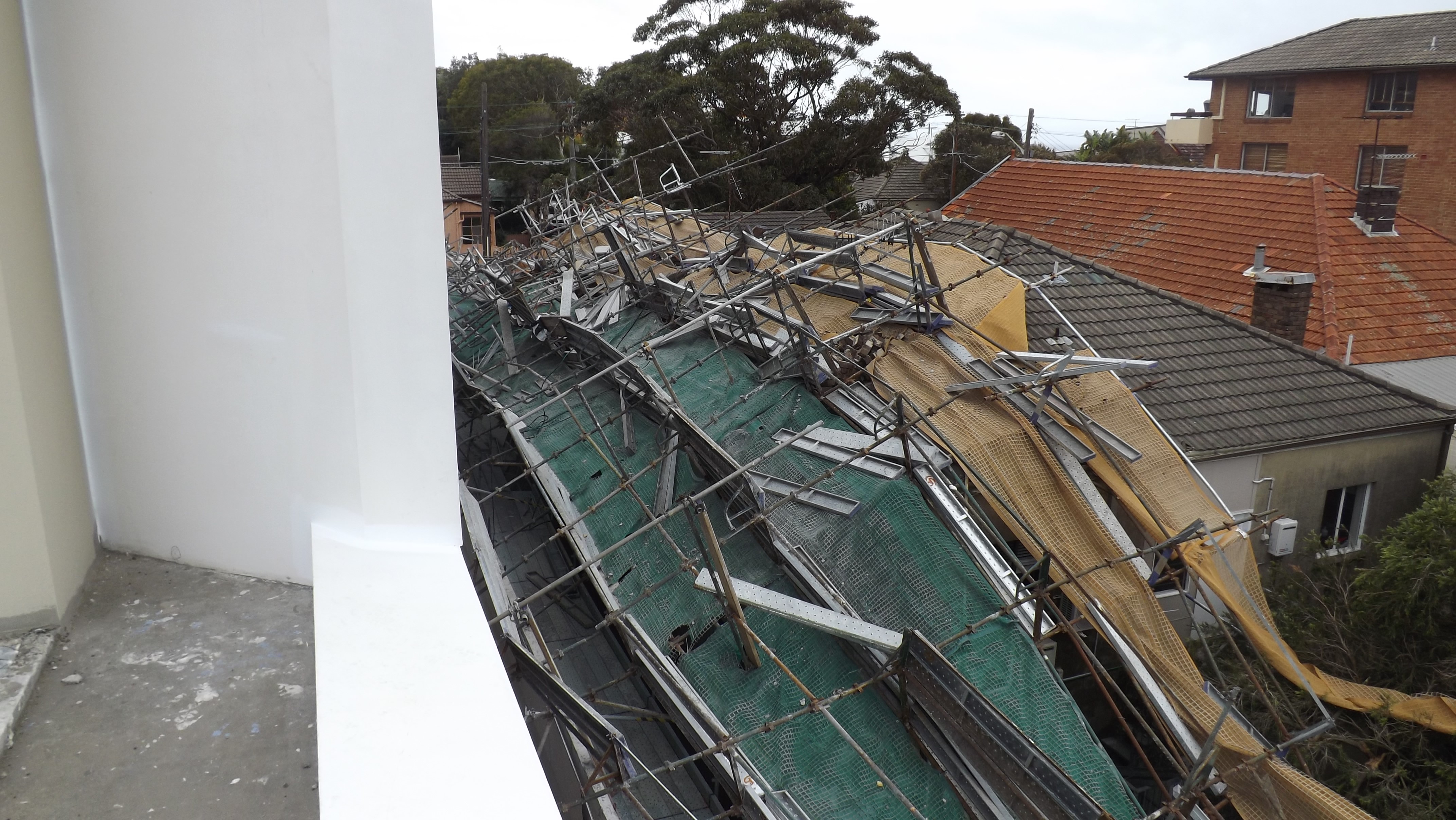 View of the 4-storey scaffolding which has collapsed and fallen onto neighbouring property