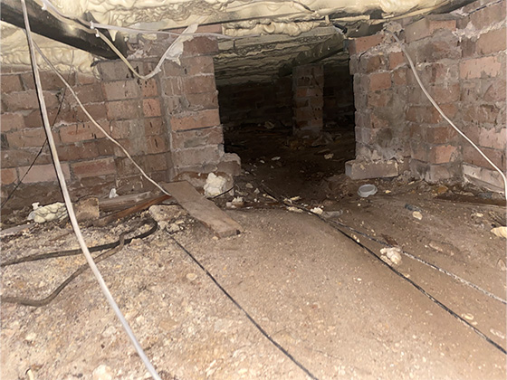 The site underneath a house where the incident occurred.