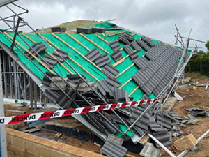 Collapsed roof of residential dwelling under constructions