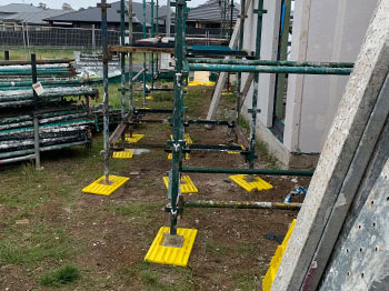 Soleplates in use underneath scaffold.