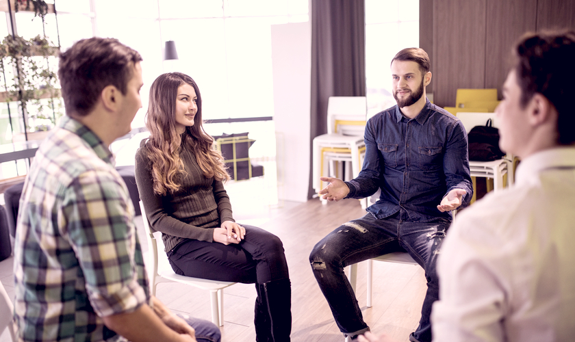 Group of people sitting around talking