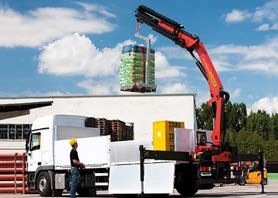 Photo of a pallet lifter being used to unload materials from a truck