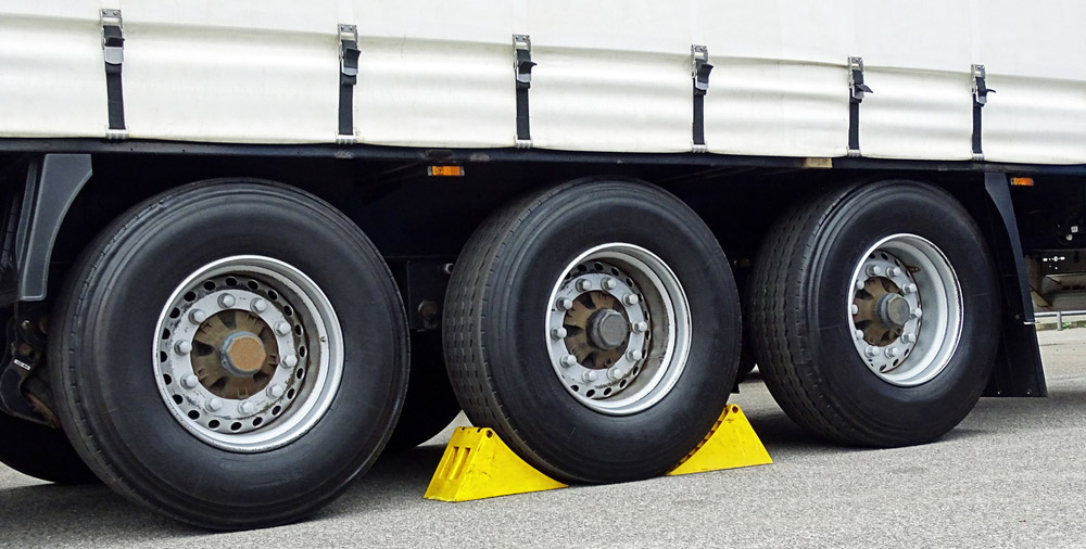 image of chocks being used at the truck wheels
