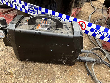 Plasma cutter on ground near police tape