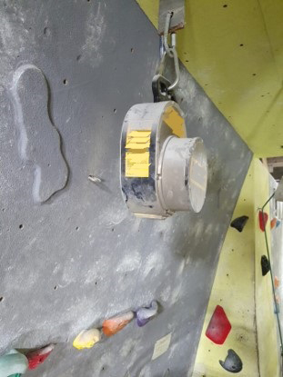 An auto-belay unit used at a rock climbing centre