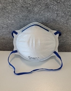 Image of a white close fitting disposable respirator