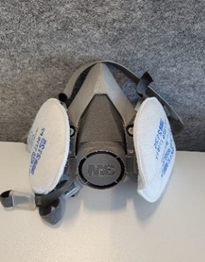 Image of a white and grey close fitting reusable respirator