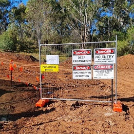 Site signage to separate people form moving plant zones and work site hazards.