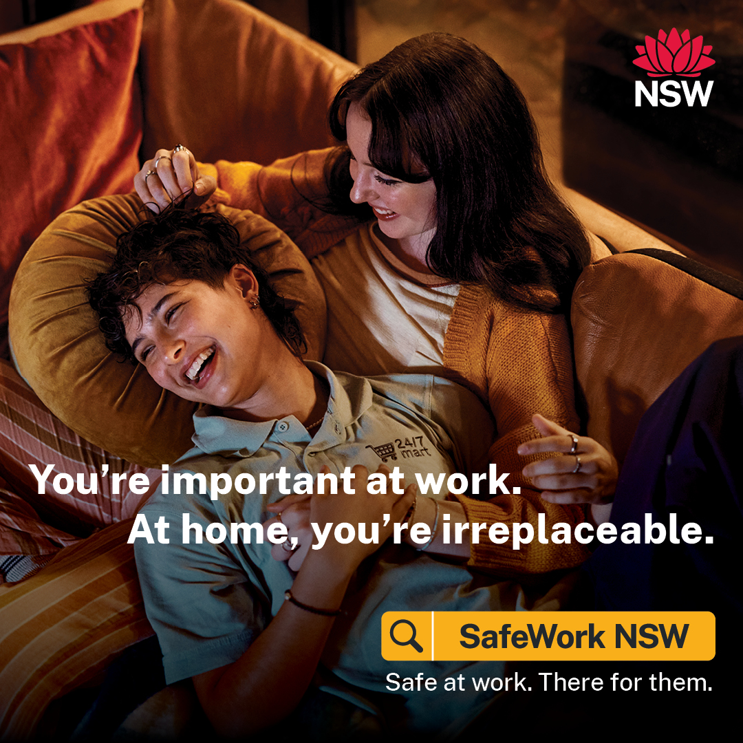 Smiling couple lounging on their sofa with text 'You're important at work. At home, you're irreplaceable